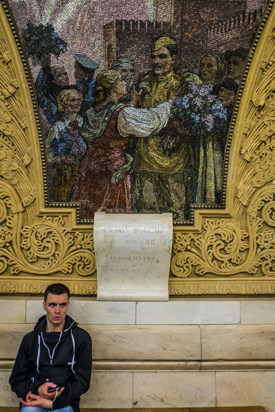 Moscow, Russia, Eurasia. A man at the Kievskaya metro station.