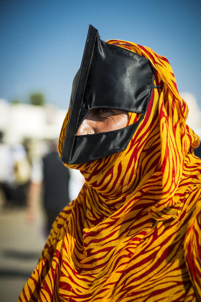 Sinaw, Sultanate of Oman, Middle East. Bedouin woman with mask.