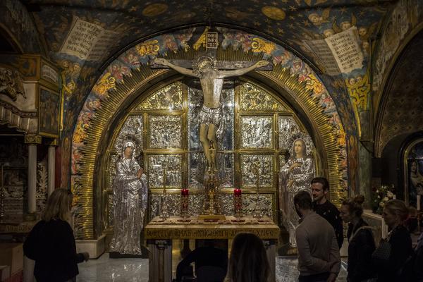 People in front of The Altar of the Crucifixion, Church of the Holy Sepulchre, Jerusalem, Israel, Middle East