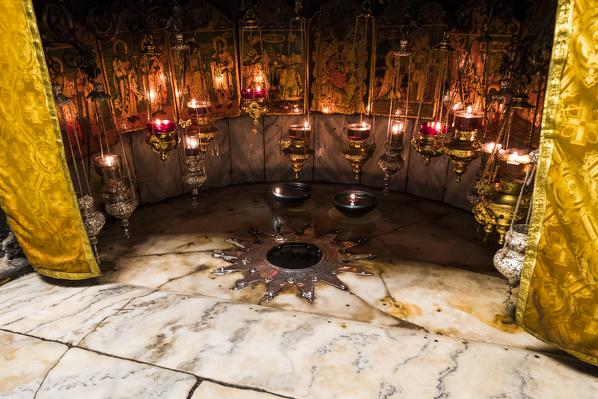 The birthplace of Jesus Christ marked with a fourteen-point silver star, the Altar of the Nativity, Church of the Nativity, Bethlehem, Palestine, Middle East