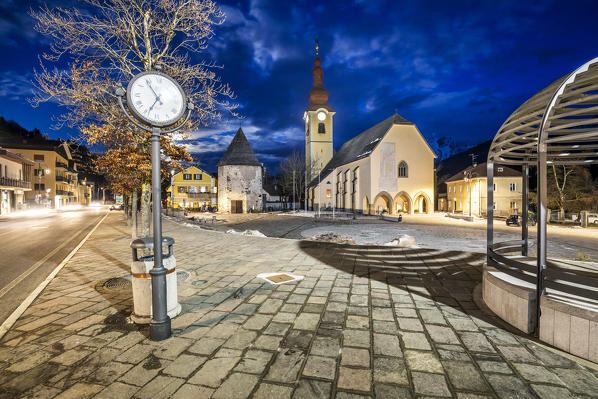 Tarvisio in Val Canale by night, main square with Sts. Peter and Paul Church, Udine, Friuli Venezia Giulia, Italy