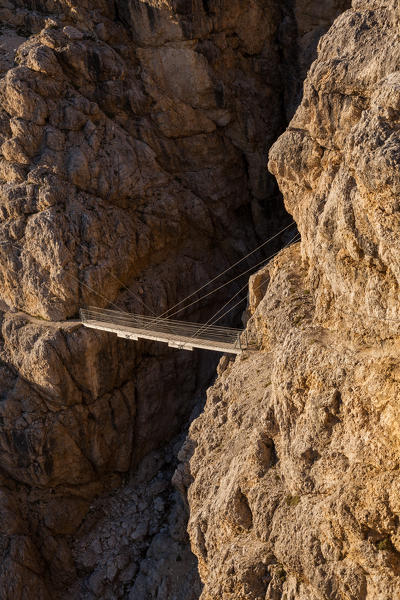Europe, Italy, Veneto, Belluno. The suspended bridge with steel cables along the Kaiserjaeger trail, Piccolo Lagazuoi, Dolomites