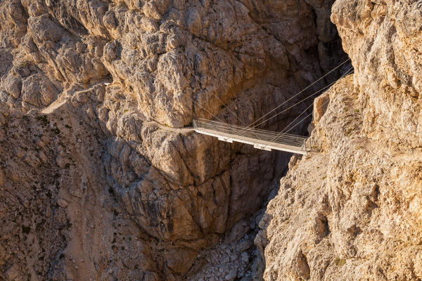 Europe, Italy, Veneto, Belluno. The suspended bridge with steel cables along the Kaiserjaeger trail, Piccolo Lagazuoi, Dolomites