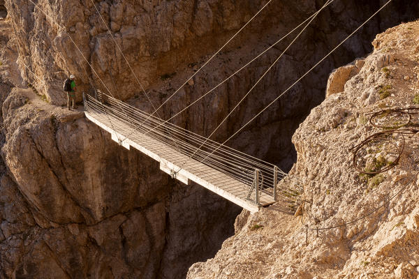 Europe, Italy, Veneto, Belluno. The suspended bridge with steel cables along the Kaiserjaeger trail, Piccolo Lagazuoi, Dolomites