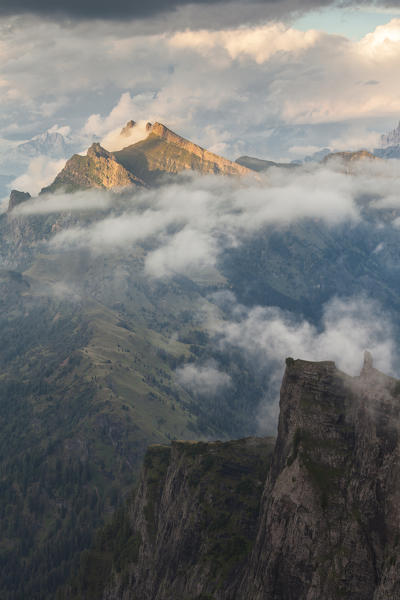 Pale di San Lucano, the green ridge of  Vanediei as seen from Campo Boaro in a summer day of clouds and sun, Agordino, Dolomites