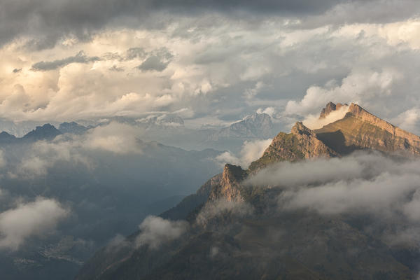 Pale di San Lucano, the green ridge of  Vanediei as seen from Campo Boaro in a summer day of clouds and sun, Agordino, Dolomites