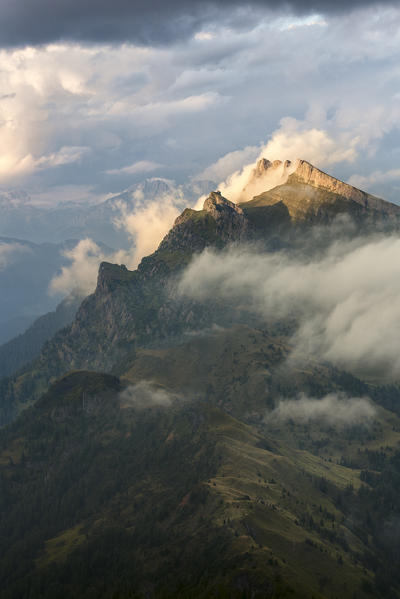 Pale di San Lucano, the green ridge of  Vanediei as seen from Campo Boaro in a summer day of clouds and sun, Agordino, Dolomites