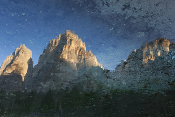 Pale di San Lucano, Reflection in small lake of the Peschiere, San Lucano valley, Taibon Agordino, Belluno, Dolomites.