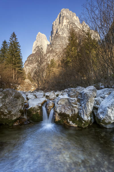 Europe, Italy, Veneto, Belluno. The vertical walls of the Pale di San Lucano (in detail the second and the third blade) views from the bed of the stream Tegnas, in the valley of San Lucano, Taibon Agordino, Dolomites