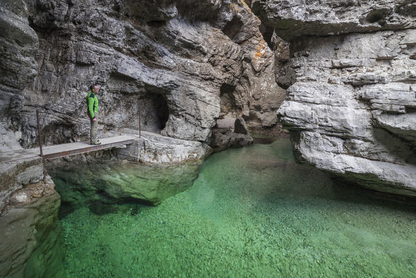 The deep canyon carved by the water coming from val Soffia, in its final part at the confluence with the lake of Mis. The color of water is a beautiful emerald green. Monti del Sole, Dolomiti Bellunesi National Park, Belluno, Veneto, Italy