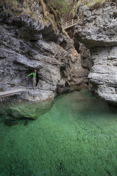 The deep canyon carved by the water coming from val Soffia, in its final part at the confluence with the lake of Mis. The color of water is a beautiful emerald green. Monti del Sole, Dolomiti Bellunesi National Park, Belluno, Veneto, Italy