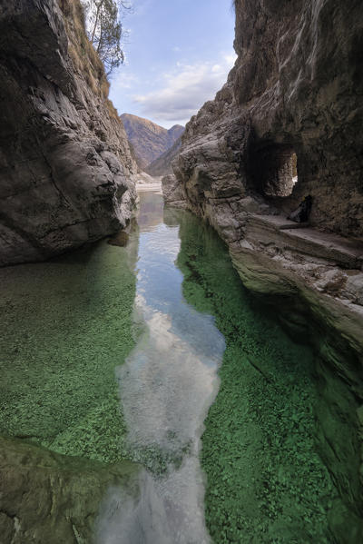 The water of the Val Soffia meets that of the Mis lake in the narrow final gorge. National Park of Dolomiti Bellunesi, Mis valley, Monti del Sole