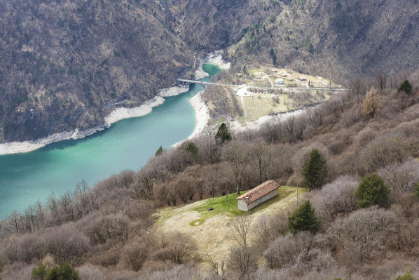 The casera Nusieda Alta, one of only three support points for hikers in the vast area of the Monti del Sole, located 970 meters above sea level on the southern side of the group, overlooking the artificial basin of the lake Mis. Monti del Sole, Dolomiti Bellunesi National Park, Belluno, Veneto, Italy
