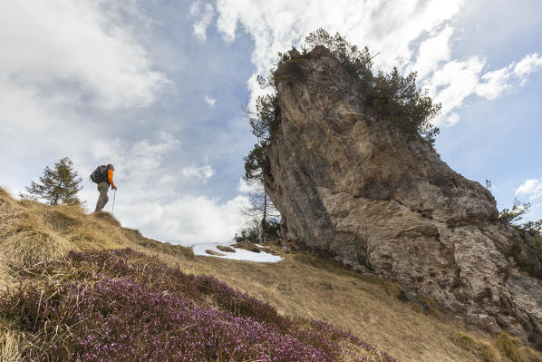 Hikers in front of the Sass of Peralora (also called the Head), Canevuze fork, Monti del Sole, Belluno Dolomites National Park