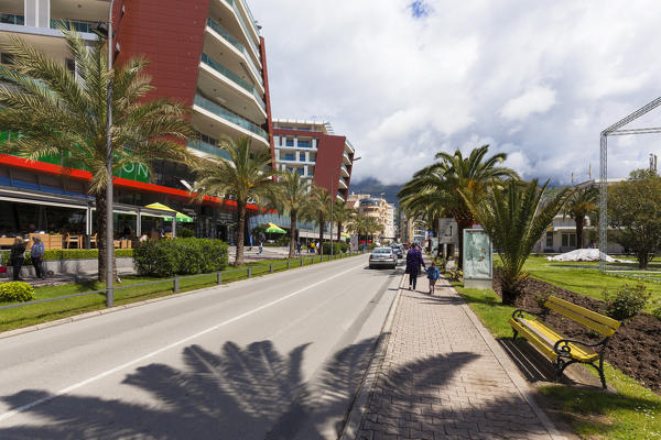 A street in Budva, between palm trees and palaces, Montenegro