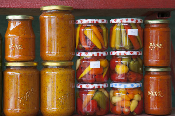 Ajvar and peppers, local products homemade, for sale in a market along the road near komin, croatia