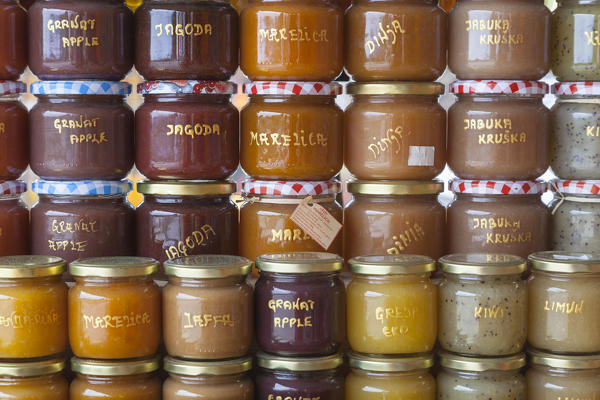 Jars of jam products from local farmers for sale in the market along the road near Komin, Croatia
