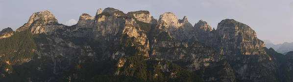 Belluno, Veneto, Italy, Dolomiti Bellunesi National Park. The south east side of the Monti del Sole as seen from Mount Peron at sunrise