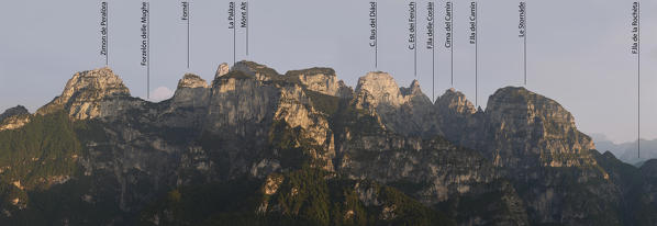 Belluno, Veneto, Italy, Dolomiti Bellunesi National Park. The south east side of the Monti del Sole as seen from Mount Peron at sunrise with the names of the peaks