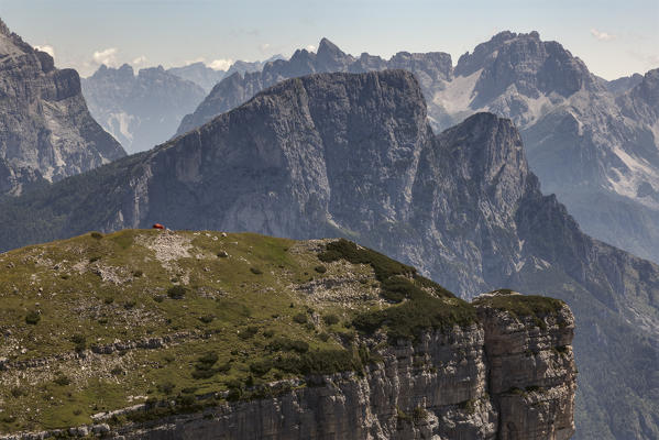 The bivouac Margherita Bedin on the first Pala of San Lucano. In succession Mount Framont and in the background and Tamer San  distant the group of Bosconero. Dolomites, Agordino, Belluno, Veneto, Italy, Europe