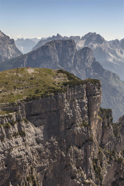 The bivouac Margherita Bedin on the first Pala of San Lucano. In succession Mount Framont and in the background and Tamer San  distant the group of Bosconero. Dolomites, Agordino, Belluno, Veneto, Italy, Europe