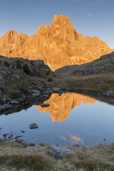 Europe, Italy, Trentino, Rolle pass. Cimon della Pala reflected in the lakes of Cavallazza at sunset, Dolomites