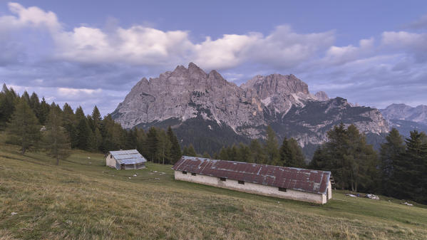 Europe, Italy, Veneto, Agordino. Panorama towards San Sebastiano with the old Duran alm in the foreground, Dolomites