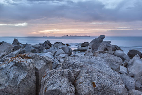 Europe, Italy, Sardinia, Cagliari. 
Sunrise on the rocks of Punta Molentis, Villasimius