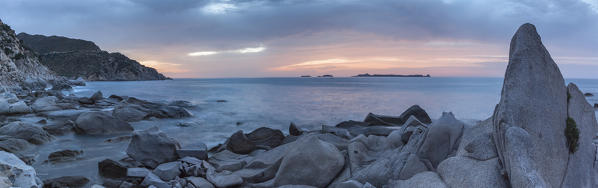 Europe, Italy, Sardinia, Cagliari. 
Sunrise on the rocks of Punta Molentis, Villasimius