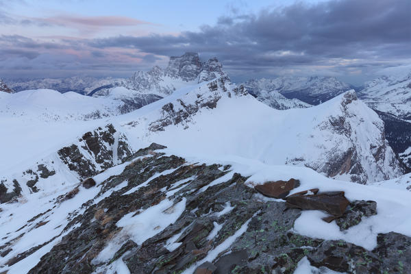 Europe, Italy, Veneto, Belluno. Winter view towards mount Mondeval, followed by the imposing mount Pelmo, Dolomites