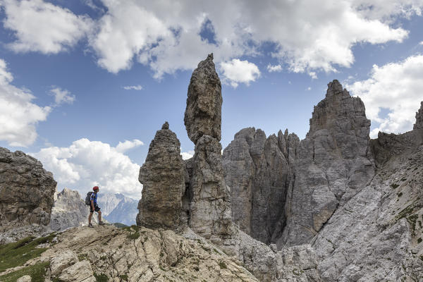 Europe, Italy, Veneto, Belluno. 
Hikers close to curious rocky pinnacles near Fork Maria, Croda dei Toni, Dolomites