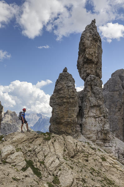 Europe, Italy, Veneto, Belluno. 
Hikers close to curious rocky pinnacles near Fork Maria, Croda dei Toni, Dolomites