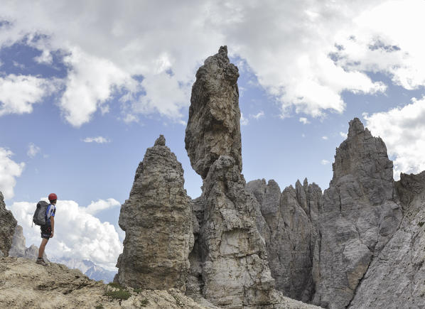 Europe, Italy, Veneto, Belluno. 
Hikers close to curious rocky pinnacles near Fork Maria, Croda dei Toni, Dolomites