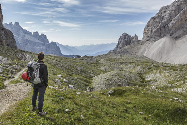 Europe, Italy, Veneto, Belluno. hiker in high Giralba valley on the way to the hut Carducci, Sexten Dolomites