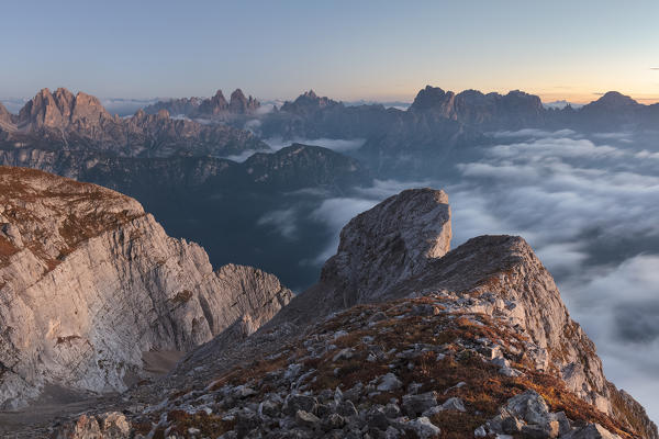 Europe, Italy, Veneto, Cadore, Auronzo. Sunrise with sea of clouds from Camosci peak, Marmarole, looking towards the Sexten Dolomites