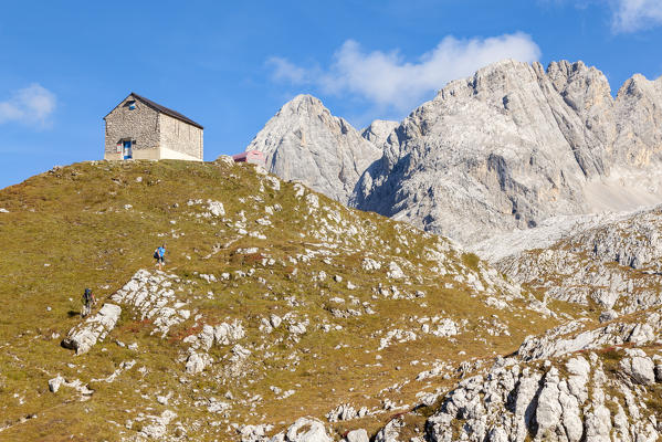 europe, Italy, Veneto, Cadore, Auronzo. Hikers arriving at the bivouac tiziano, Marmarole North, dolomites