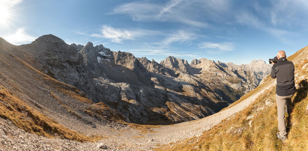 Europe, Italy, Veneto, Cadore, Auronzo. Photographer in front of Marmarole, Dolomites