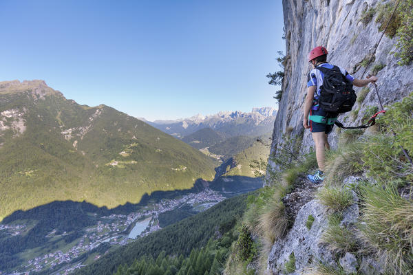 Europe, Italy, Veneto, Agordo, mountain climber on the via ferrata Fiamme Gialle at Palazza Alta of Pelsa, Civetta group, Dolomites