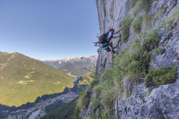 Europe, Italy, Veneto, Agordo, mountain climber on the via ferrata Fiamme Gialle at Palazza Alta of Pelsa, Civetta group, Dolomites