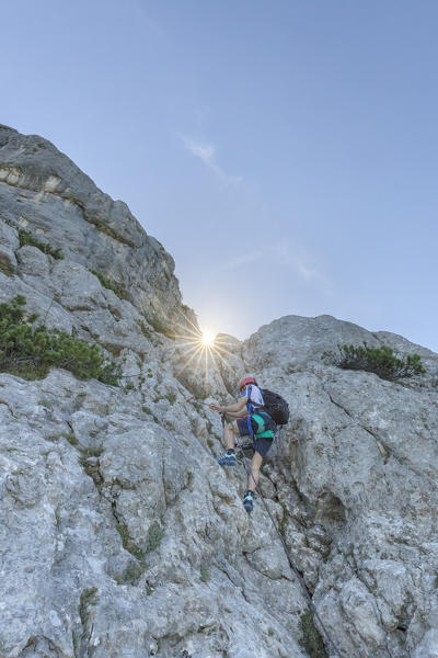 Europe, Italy, Veneto, Agordo, mountain climber on the via ferrata Fiamme Gialle at Palazza Alta of Pelsa, Civetta group, Dolomites
