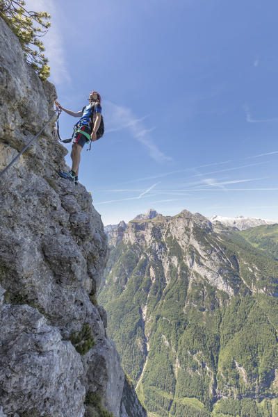 Europe, Italy, Veneto, Agordo, mountain climber on the via ferrata Fiamme Gialle at Palazza Alta of Pelsa, Civetta group, Dolomites