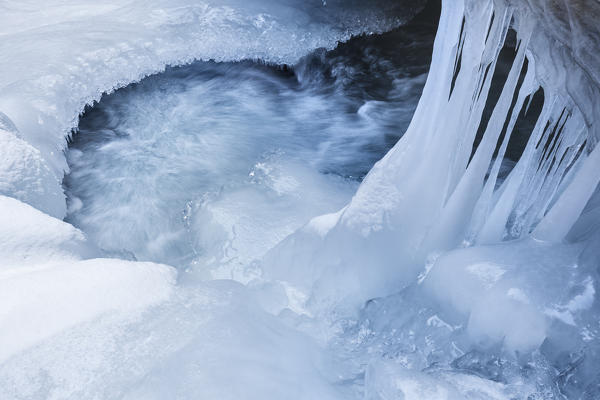 Europe, Italy, Veneto, Belluno, Sappada, Ice details in the Piave stream near the waterfall of Acqua Tona