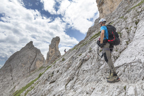 Climbers on the via ferrata Cengia Gabriella, Popera group, Giralba, Sexten Dolomites, Belluno, Veneto, Italy