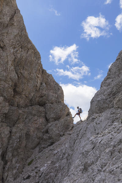 Climber on the via ferrata Roghel, Popera group, Sexten Dolomites, Comelico Superiore, Belluno, Veneto, Italy