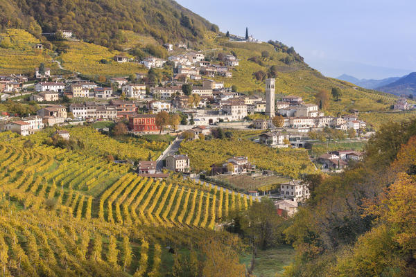 the village of Santo Stefano surrounded by the yellow vineyards in autumn, along the road of wine, Valdobbiadene, Treviso, Veneto, Italy