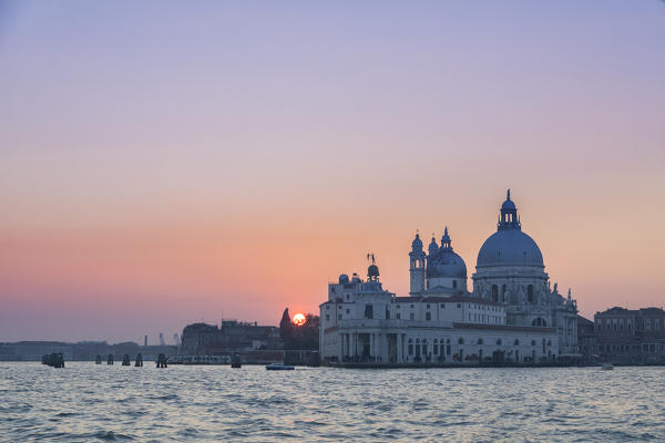 the Grand Canal at sunset with Basilica of Saint Mary of Health, Punta della Dogana, Venice, Veneto, Italy