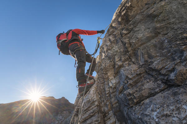 Mountaineer along the via ferrata on the north side of mount Gr. Kinigat, Kartitsch, East Tyrol, Austria, Europe