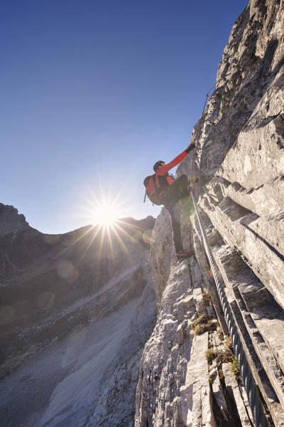 Mountaineer along the via ferrata on the north side of mount Gr. Kinigat, Kartitsch, East Tyrol, Austria, Europe