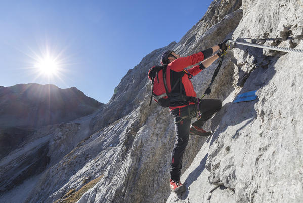 Mountaineer along the via ferrata on the north side of mount Gr. Kinigat, Kartitsch, East Tyrol, Austria, Europe