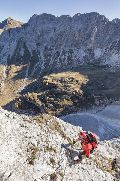 Mountaineer along the via ferrata on the north side of mount Gr. Kinigat, Kartitsch, East Tyrol, Austria, Europe